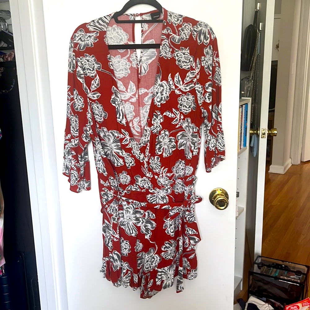 Orange and white floral romper with sleeves